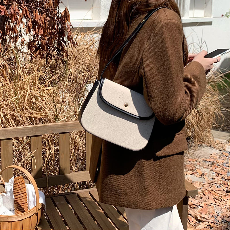 black piping handbag