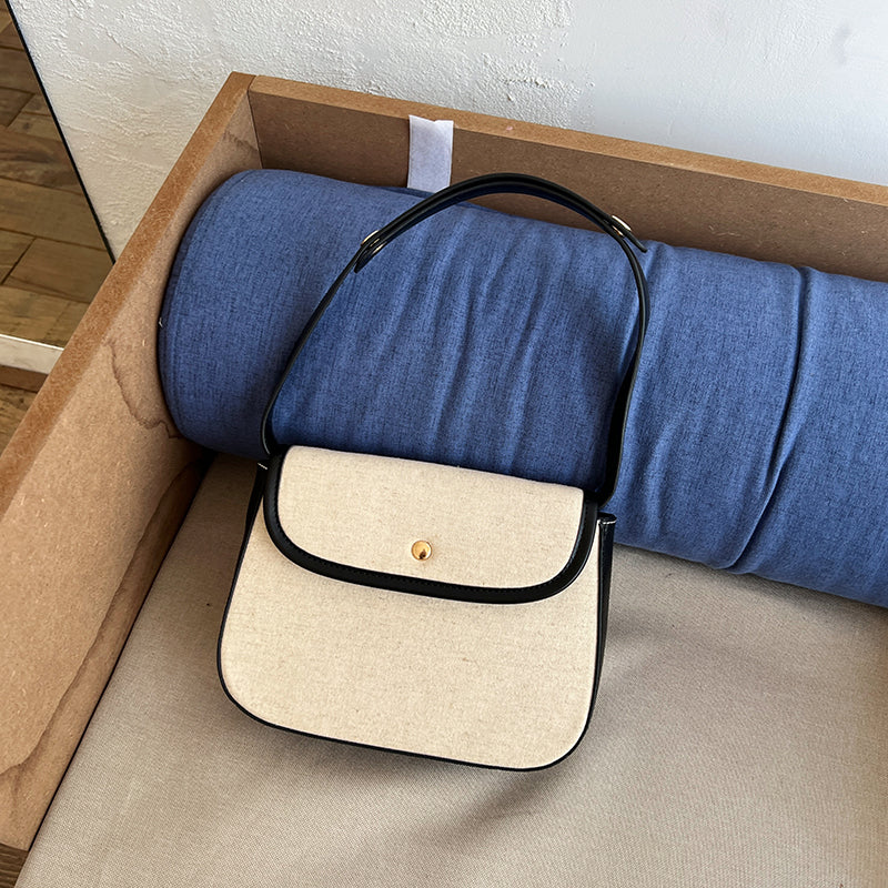 black piping handbag