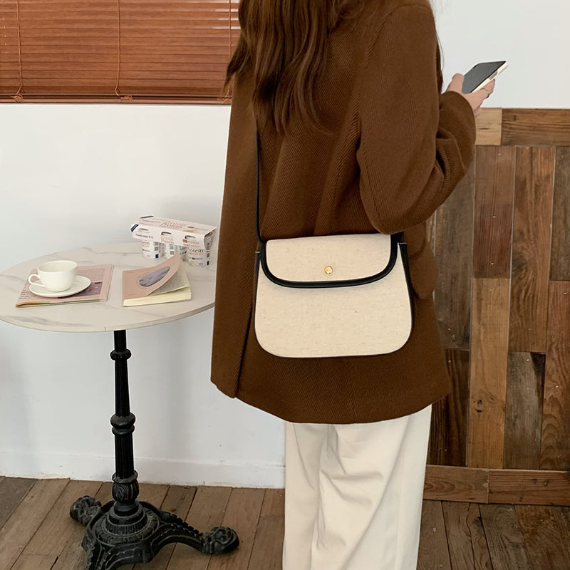 black piping handbag