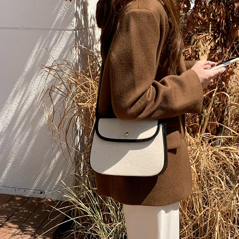 black piping handbag