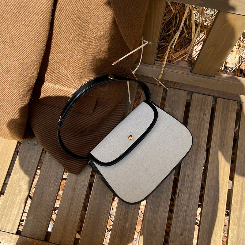 black piping handbag
