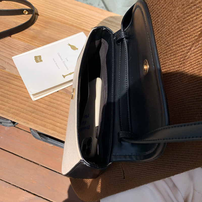 black piping handbag