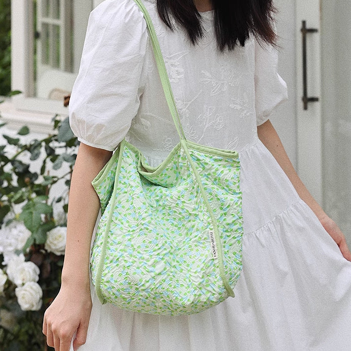 green embossed flower tote bag