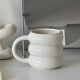 white ceramic baum mug