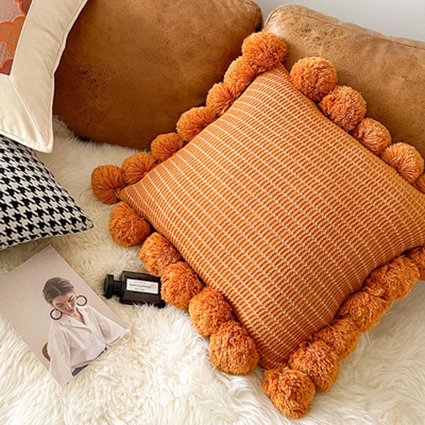 orange motif ponpon cushion